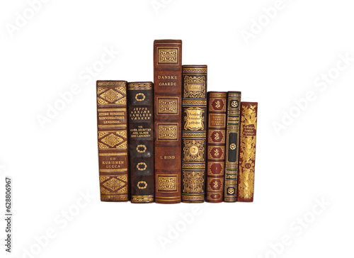 Old leather books with shiny gold decorations.