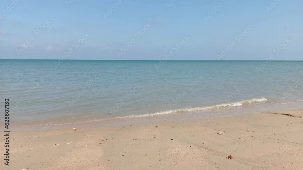 Natural Scenery Of Blue Sea Water, With Clean Yellow Sand Beaches Natural Scenery Of Blue Sea Water, With Clean Yellow Sand Beaches