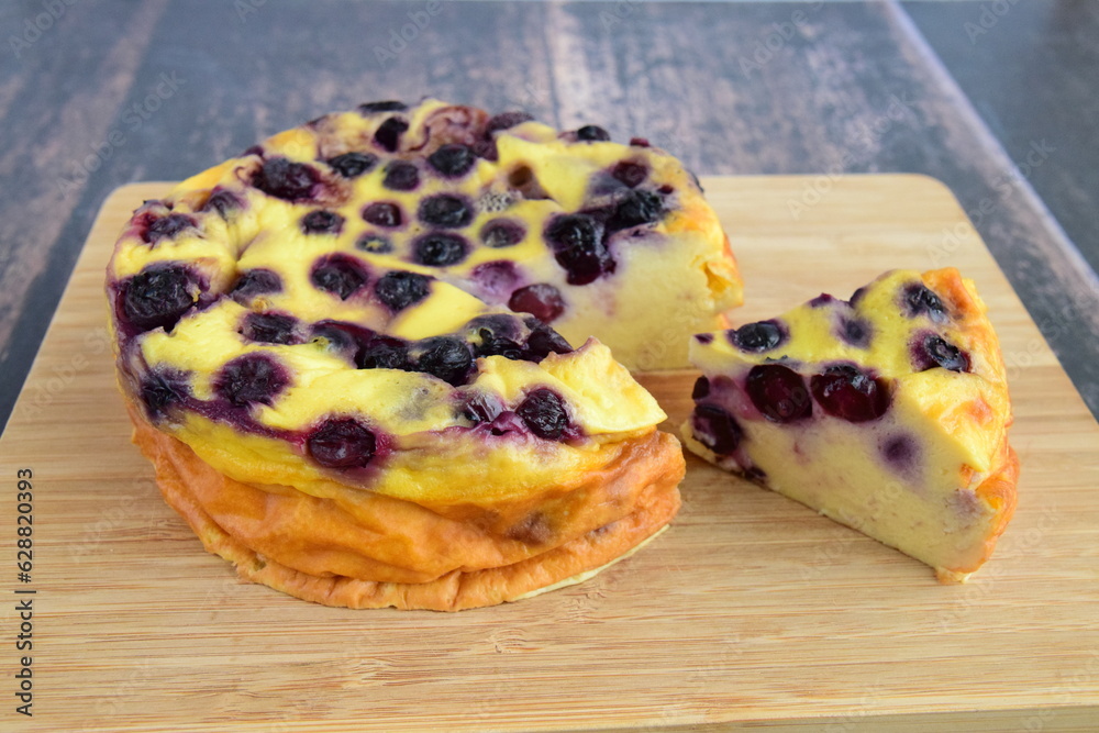 Blueberry yogurt cake on wooden board Blueberry yogurt cake on wooden board