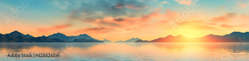 Sunset over the lake. Panoramic view of the mountains.