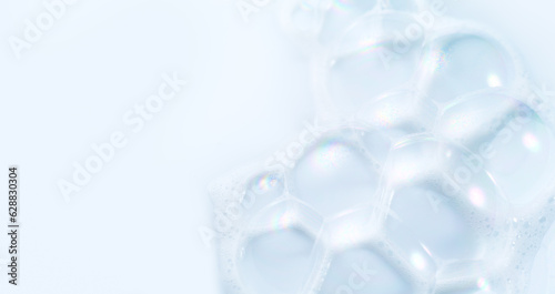 Wallpaper Mural Foam border design on blue background. Liquid soap bubbles, Foam bubbles background. Soap foam popping bubble, white backdrop. Soap sud macro structure. Soap foam close-up. Clean, cleaning, washing. Torontodigital.ca