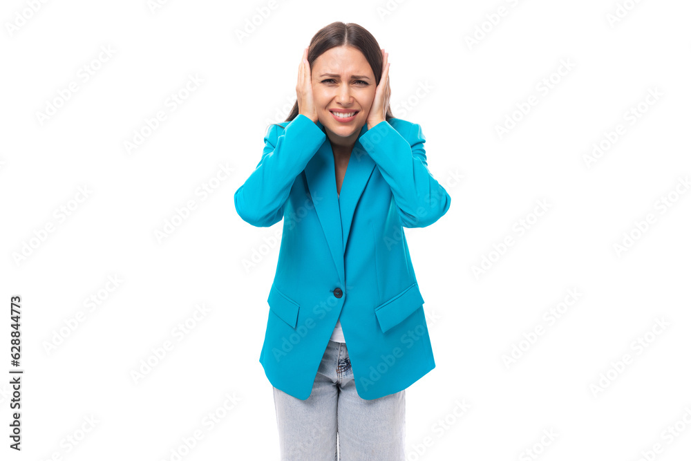 young indignant well-groomed office worker woman with black straight hair in a blue business jacket on a white background with copy space young indignant well-groomed office worker woman with black straight hair in a blue business jacket on a white background with copy space