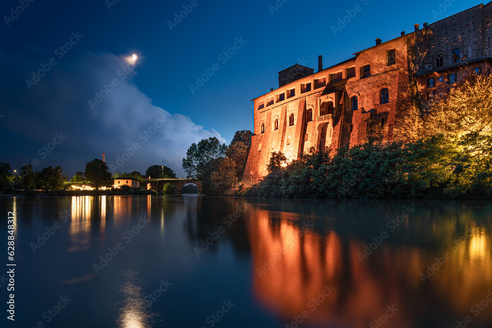Castle by the river at night