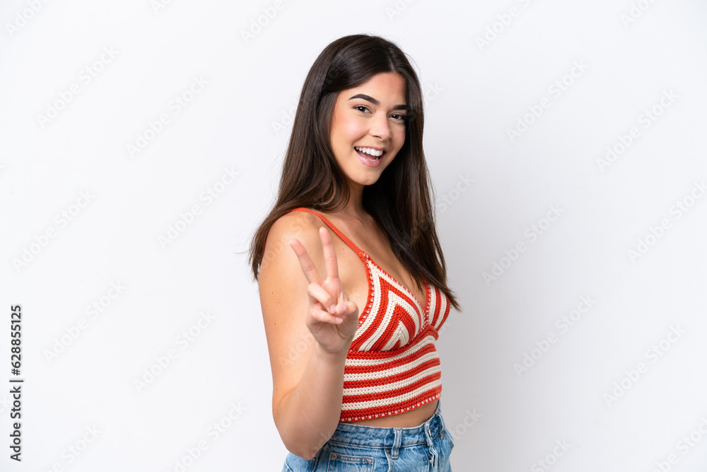 Young Brazilian woman isolated on white background smiling and showing victory sign Young Brazilian woman isolated on white background smiling and showing victory sign
