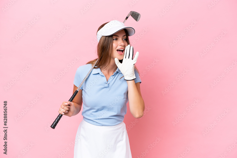 Young golfer player man isolated on pink background shouting with mouth wide open to the side Young golfer player man isolated on pink background shouting with mouth wide open to the side