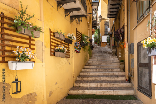 Fototapeta Naklejka Na Ścianę i Meble -  Colorful Narrow street with stairs of the old town of Agrigento, Sicily, Italy
