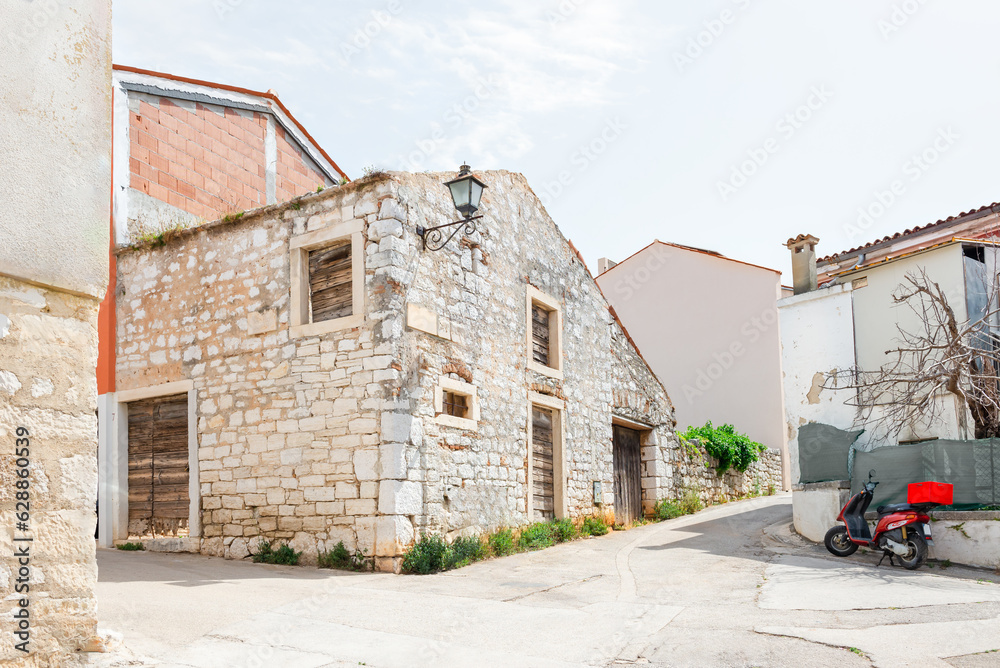 Medieval dilapidated house at the crossroads in the historical part of Rovinj