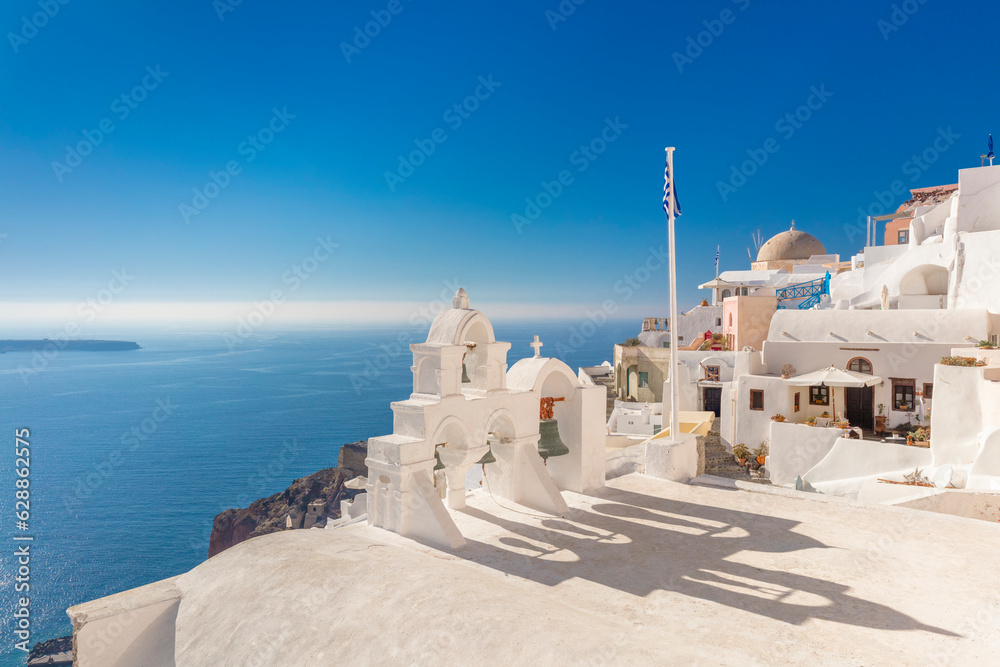 Famous Santorini, Oia, Greece. Minimalistic composition traditional architecture of Santorini island. White arches with domes against the background of the blue sea - obrazy, fototapety, plakaty 