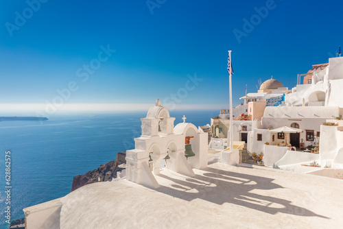 Famous Santorini, Oia, Greece. Minimalistic composition traditional architecture of Santorini island. White arches with domes against the background of the blue sea