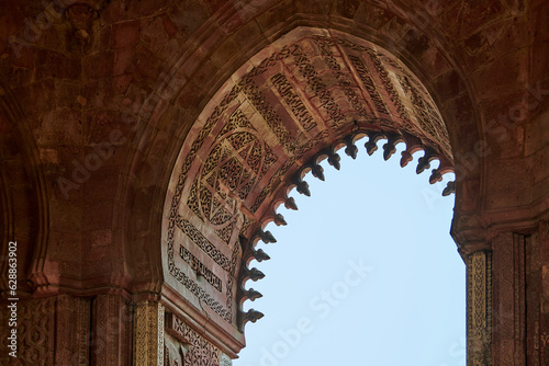 Alai Darwaza landmark part Qutb complex in South Delhi, India, Alai Darwaza main gateway decorated with red sandstone and inlaid white marble decorations, popular touristic spot in New Delhi photo