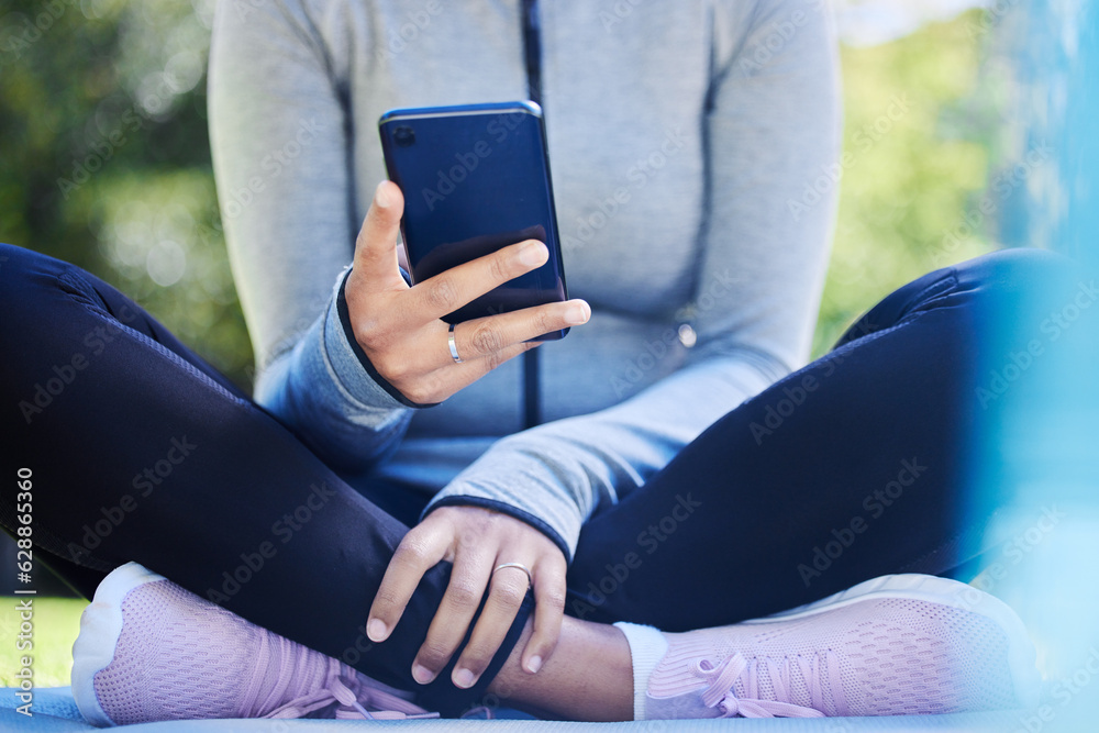 Yoga, phone and hands of woman in park for fitness app, social media and workout. Relax, technology and communication with closeup of female person and mobile in nature for search, exercise and peace