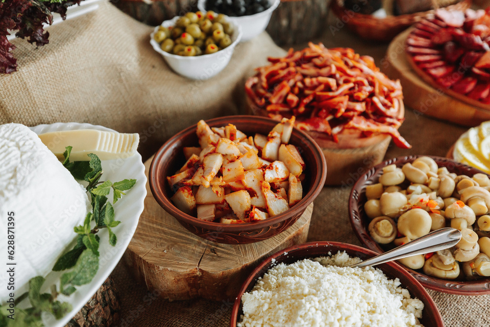 Cossack table in the best restaurants. Festive table at the wedding. National Ukrainian cuisine. Fat, sausages, alcohol. Catering. Cossack table in the best restaurants. Festive table at the wedding. National Ukrainian cuisine. Fat, sausages, alcohol. Catering.