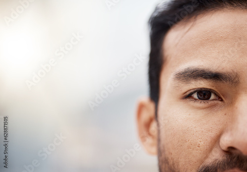 Human, eye and closeup portrait of man with mockup, background for advertising space or banner of Asian person Serious face and vision or focus for wellness, health and thinking of future in care photo