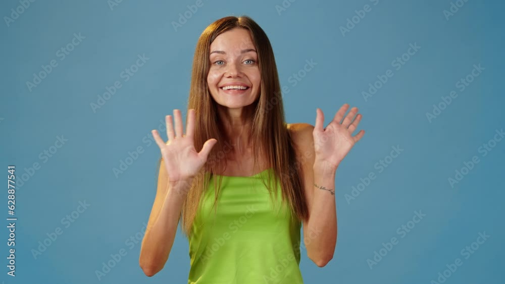 Portrait of friendly cute lady waving hello and smiling Portrait of friendly cute lady waving hello and smiling