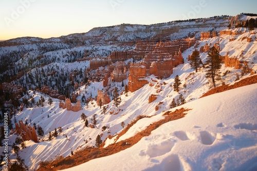 Scenic winter landscape in Bryce Canyon National Park featuring snow-covered cliffs. Utah, USA.