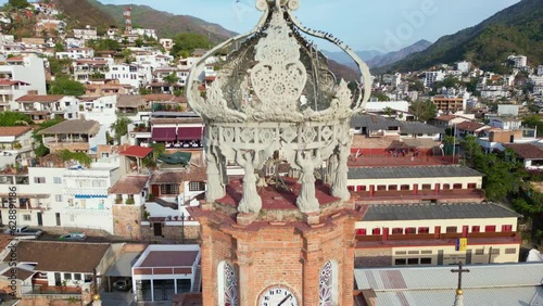 4K Drone flying towards the bell tower of the Parish Of Our Lady Of Guadalupe in Puerto Vallarta photo