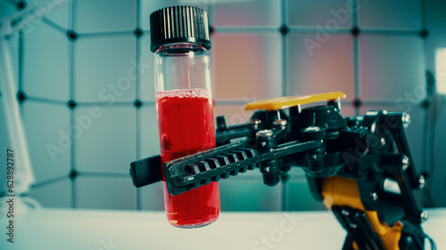 a robot holds a sample of a chemical substance