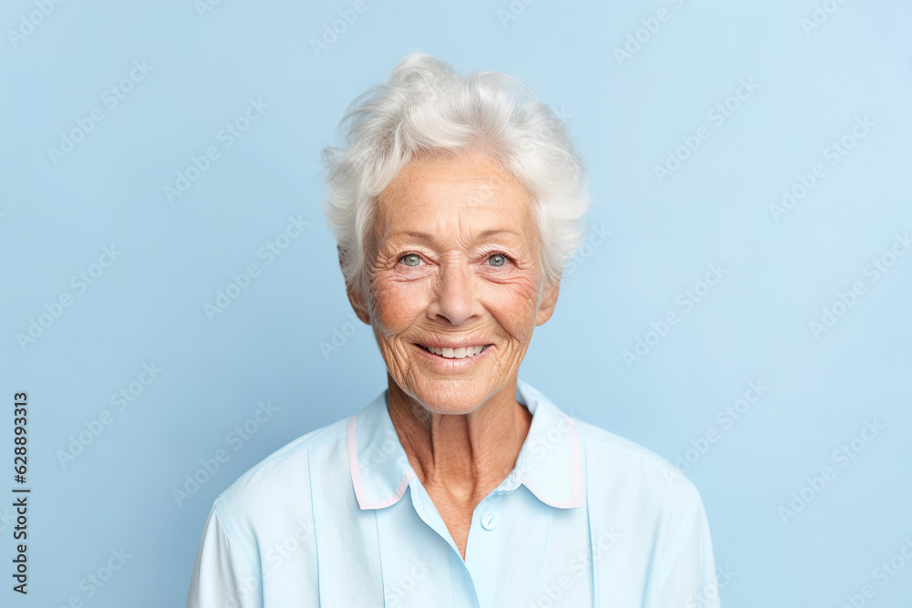 Beautiful elderly woman with gray hair smiling at the camera. Happy old age concept Beautiful elderly woman with gray hair smiling at the camera. Happy old age concept