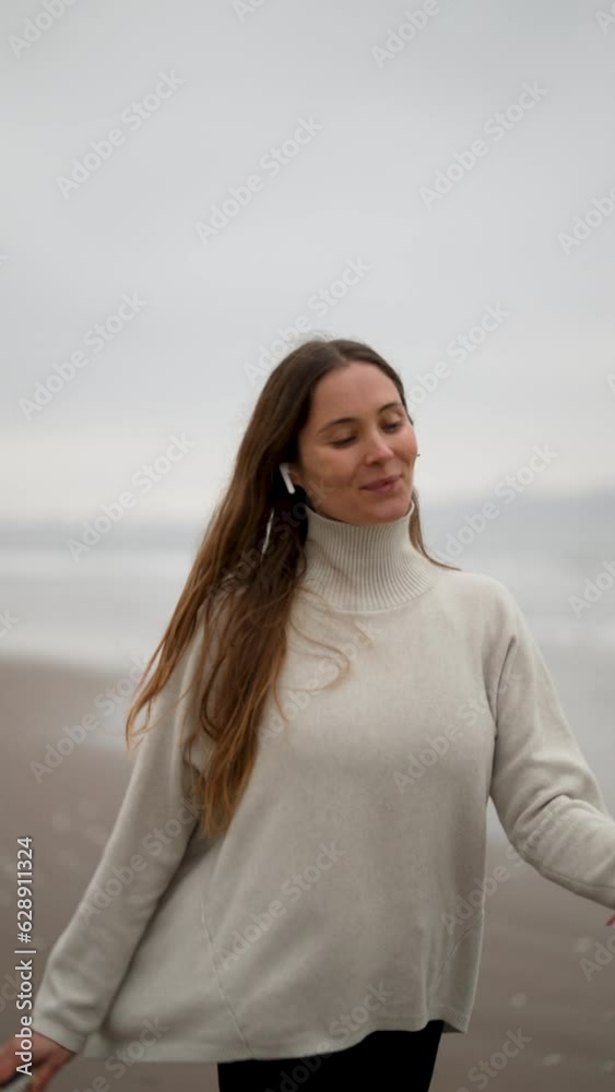 on the move portrait beautiful mid adult caucasian woman jogging on the beach happy listening to music on the move portrait beautiful mid adult caucasian woman jogging on the beach happy listening to music