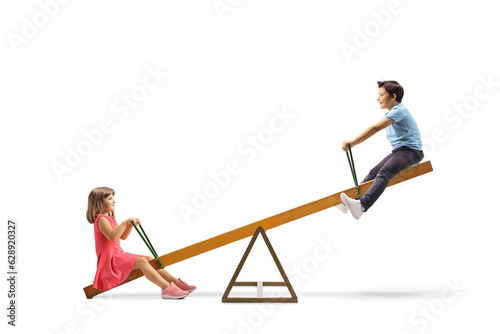 Children playing on a wooden seesaw