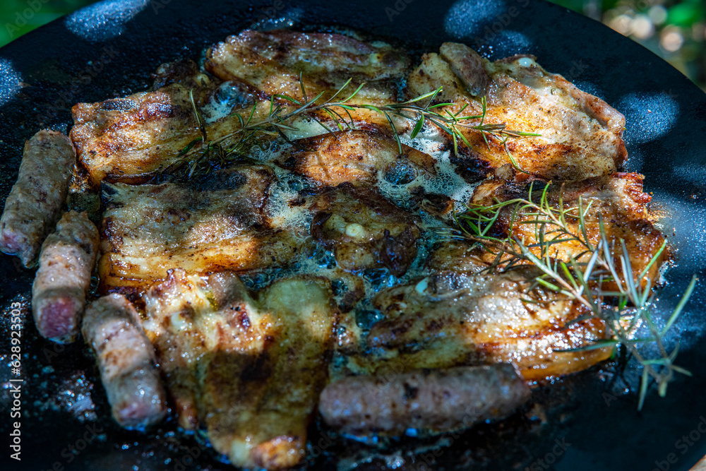 grilled pork meat with spices, on a grill grilled pork meat with spices, on a grill