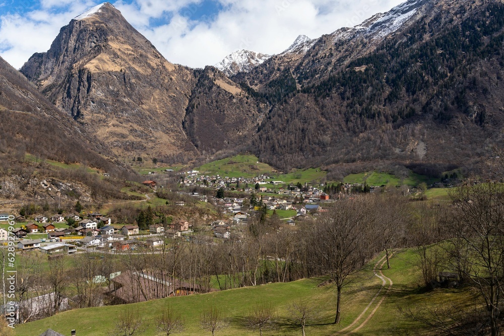the village in the middle of a valley surrounded by mountains