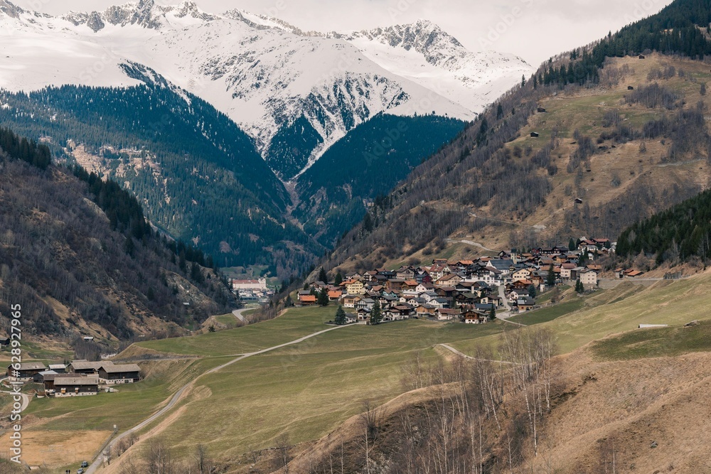 Picturesque rural area with small homes nestled in the mountains Picturesque rural area with small homes nestled in the mountains