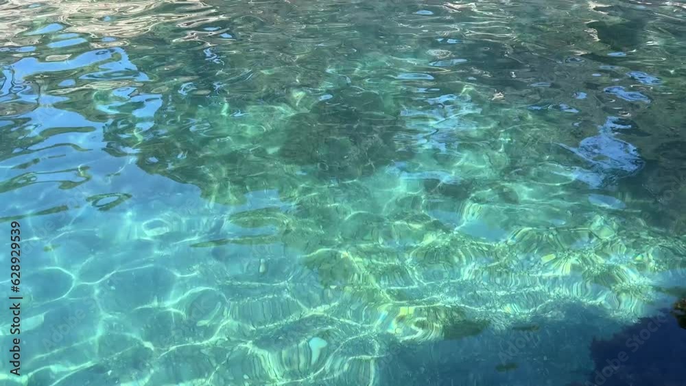 Crystal clear blue water in the sea. Crystal clear blue water in the sea.