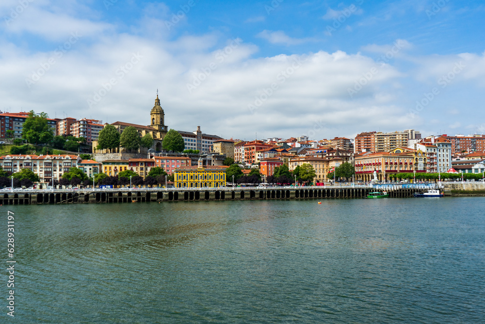 Portugalete town by Nervion river, and Sandra Maria basilica, Basque Country, Spain.