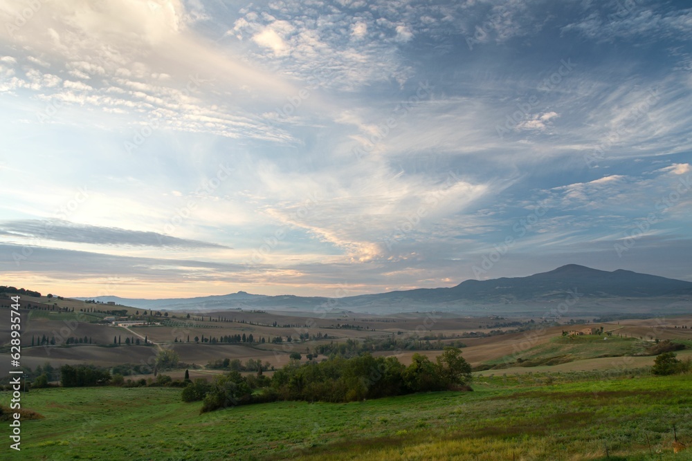 Idyllic countryside view of the rolling hills of the Tuscany region near the town of Pienza, Italy Idyllic countryside view of the rolling hills of the Tuscany region near the town of Pienza, Italy