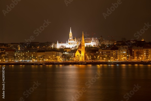 Stunning nighttime skyline from the banks of the Danube River in Buda, Hungary