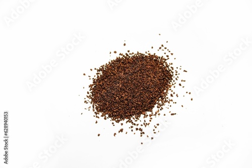 Pile of freshly ground dried tea isolated on a white background