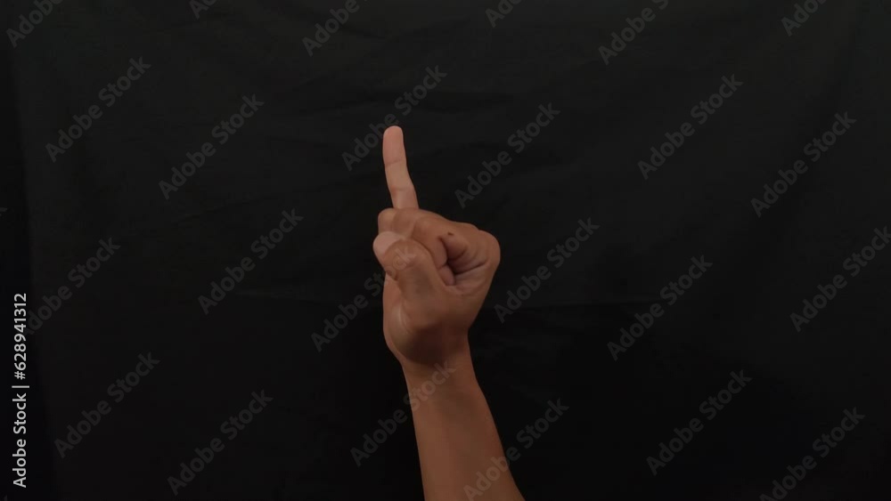 American sign language (ASL).A man's hand doing one-handed sign language used by deaf and dumb. man's hand doing Alphabet J sign language in 4K.  J alphabet sign.