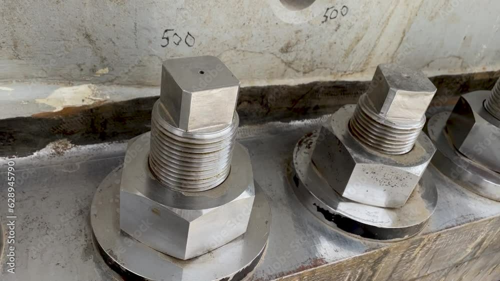 Bolted connection of parts of a ball mill close up. Copper processing plant equipment Bolted connection of parts of a ball mill close up. Copper processing plant equipment