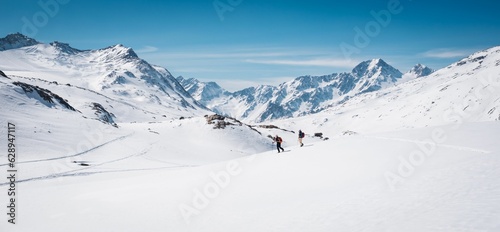 Breathtaking winter scene featuring adventurers in Italy's Val Senales, South Tyrol photo