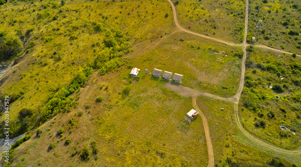 Panoramic shot of the steppe with dirt roads in nature. Top view from a drone Panoramic shot of the steppe with dirt roads in nature. Top view from a drone
