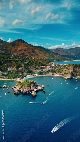 Sunny Day Vertical Drone Footage of Taormina Beaches, Sicily. photo