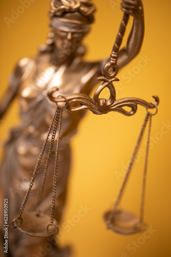 Themis and gavel in court library