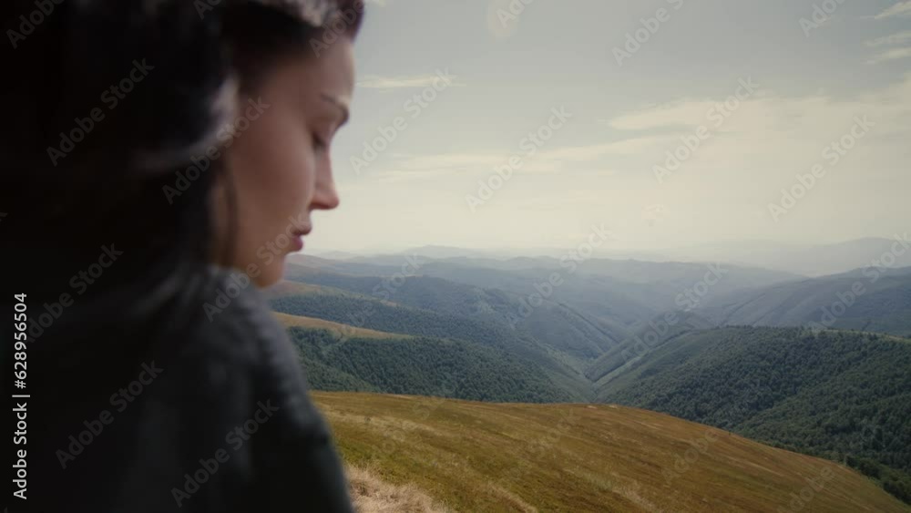 Girl on the top of rocky mountain on a foggy day Girl on the top of rocky mountain on a foggy day