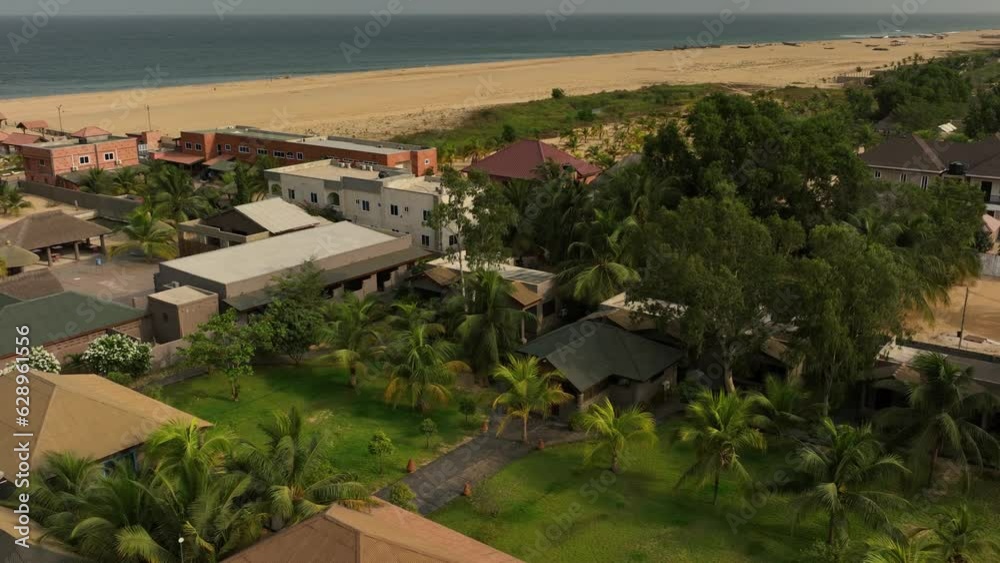 Aerial video of buildings and palm trees on the sea shore in Accra, Ghana Aerial video of buildings and palm trees on the sea shore in Accra, Ghana