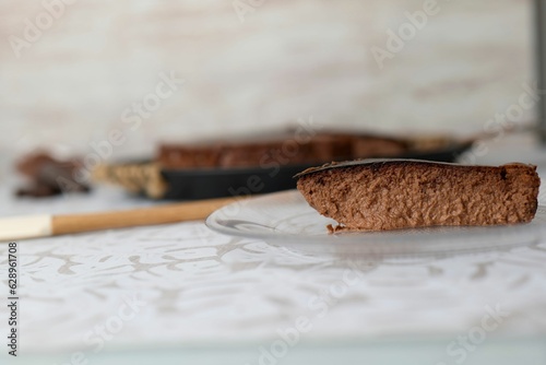 Closeup of a delicious biscuit on the wooden table with a white background