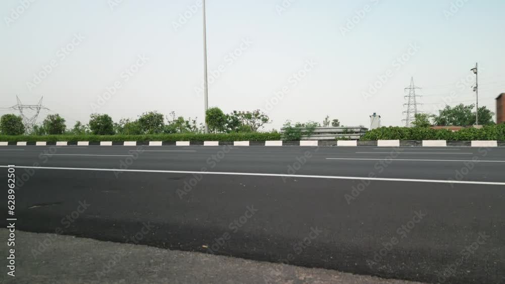 View of vehicles passing on an expressway, view of cars moving on a highway View of vehicles passing on an expressway, view of cars moving on a highway