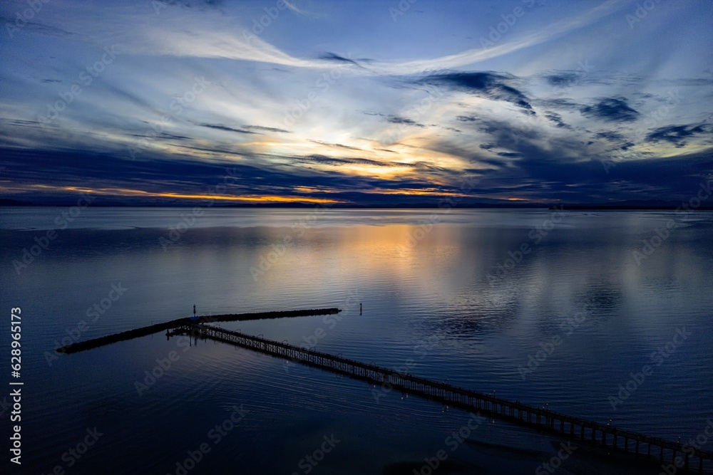 Stunning view of the pier at sunset in White Rock, British Columbia, Canada Stunning view of the pier at sunset in White Rock, British Columbia, Canada