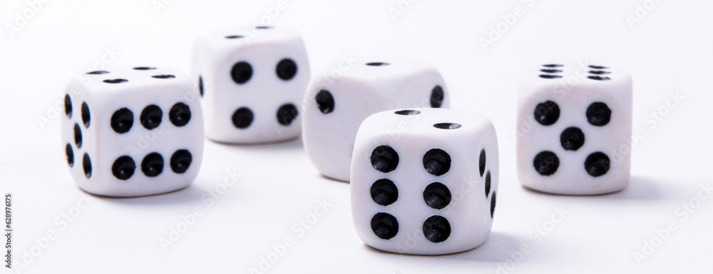 White game dice on a white background. Selective focus. White game dice on a white background. Selective focus.