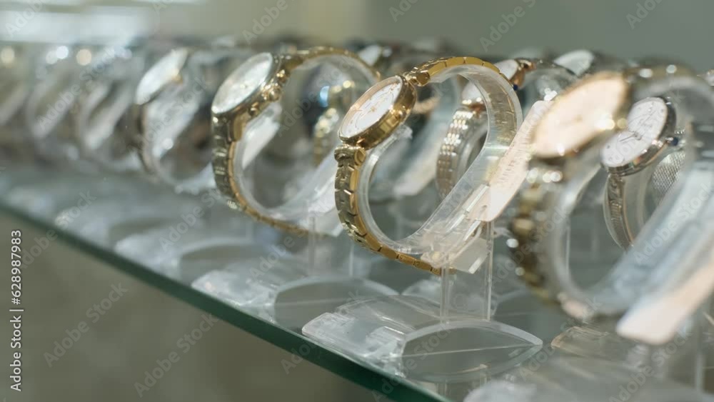 Assortment of expensive wristwatches in a boutique showcase, close-up Assortment of expensive wristwatches in a boutique showcase, close-up