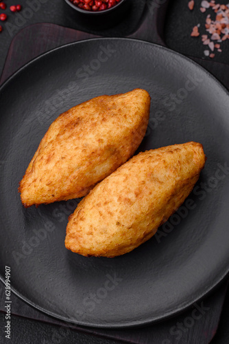 Delicious baked potato cutlet stuffed with chicken and vegetables, spices and salt