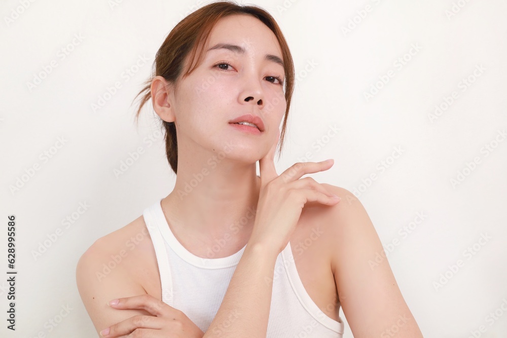 Beautiful Asian woman applying serum on face, Portrait Beautiful Asian woman in nature makeup with smiling face. Beautiful Asian woman applying serum on face, Portrait Beautiful Asian woman in nature makeup with smiling face.