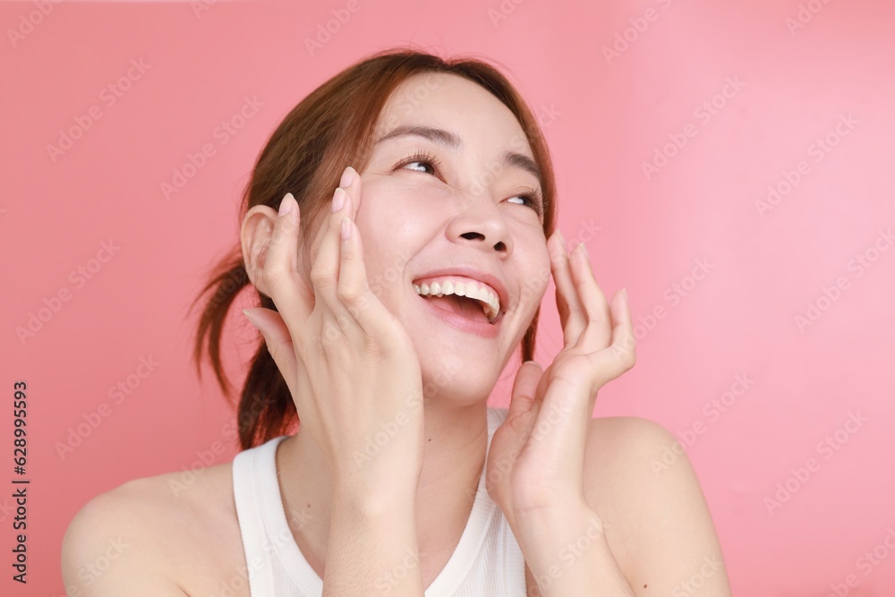 Beautiful Asian woman applying serum on face, Portrait Beautiful Asian woman in nature makeup with smiling face. Beautiful Asian woman applying serum on face, Portrait Beautiful Asian woman in nature makeup with smiling face.