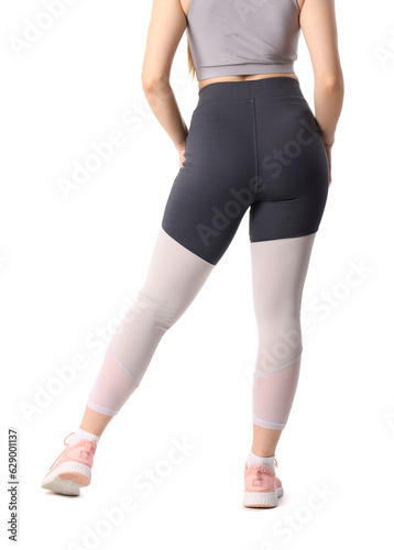 Sporty young woman in leggings on white background, back view