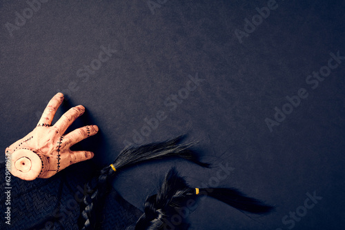 The Thing, black hair, spider web on dark background. Wednesday style Halloween party banner design. photo